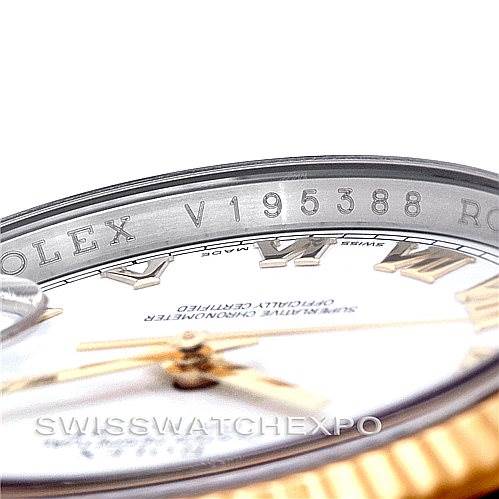 The image shows the serial number and part of the dial and bezel of a Rolex Datejust 116233 Men's Stainless Steel White Dial 116233 Men's Stainless Steel White Dial watch from a close-up angle.