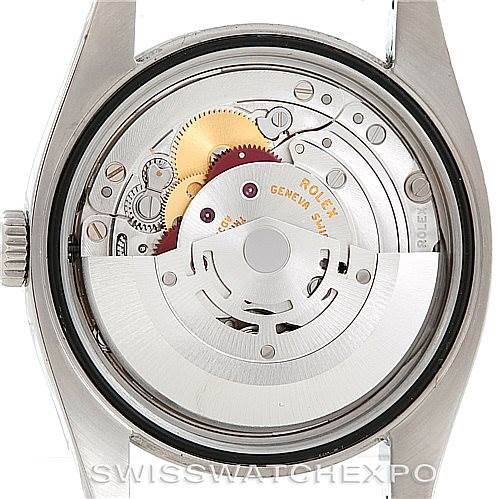 The image shows the back side of a Rolex Datejust 116200 Men
s Stainless Steel White Dial 116200 Men
s Stainless Steel White Dial watch, revealing its internal mechanical movement.