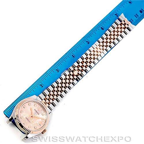 The image shows the entire Rolex Datejust 116231 Men's Steel and Gold (two tone) Pink Dial 116231 Men's Steel and Gold (two tone) Pink Dial watch laid flat with a ruler measuring the length of the band.