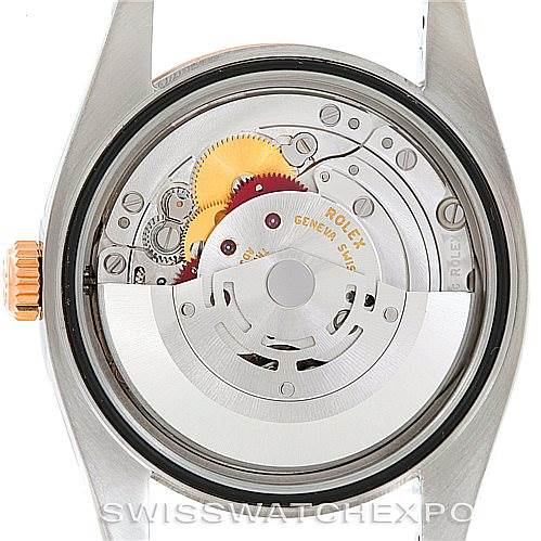 The image shows the inner mechanical movement and parts of a Rolex Datejust 116231 Men's Steel and Gold (two tone) Pink Dial 116231 Men's Steel and Gold (two tone) Pink Dial watch from a rear angle.