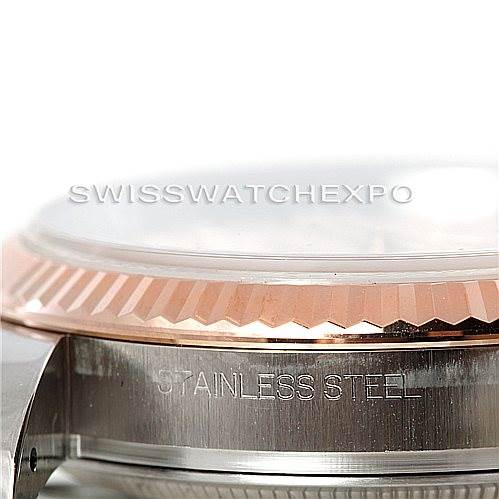 This image shows a close-up side view of the bezel and case of a Rolex Datejust 116231 Men's Steel and Gold (two tone) Pink Dial 116231 Men's Steel and Gold (two tone) Pink Dial watch, highlighting the stainless steel inscription.