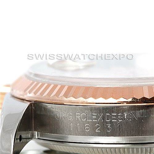 The image shows a side angle of the Rolex Datejust 116231 Men's Steel and Gold (two tone) Pink Dial 116231 Men's Steel and Gold (two tone) Pink Dial, focusing on the bezel and the engraved model and brand details.