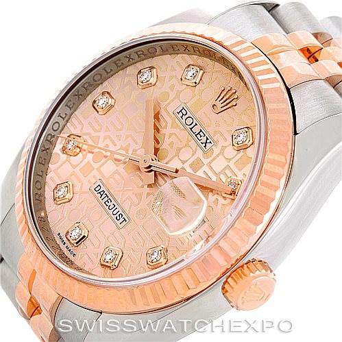 This image shows a close-up angle of the Rolex Datejust 116231 Men's Steel and Gold (two tone) Pink Dial 116231 Men's Steel and Gold (two tone) Pink Dial watch, highlighting the dial, hands, crown, and part of the bracelet.