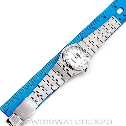 The image shows a top view of a Rolex Datejust 17014 Men's Stainless Steel White Dial 17014 Men's Stainless Steel White Dial watch placed alongside a ruler for measurement.