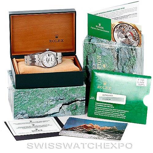 This image shows a Rolex Datejust 17014 Men's Stainless Steel White Dial 17014 Men's Stainless Steel White Dial watch in its box, accompanied by its factory service booklet, warranty card, and additional documentation.