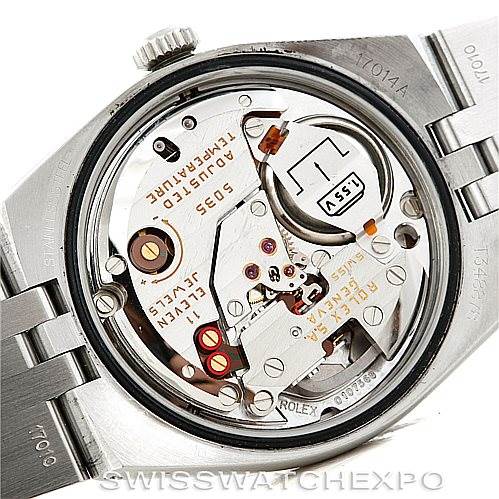 This image shows the inner mechanics and movement of a Rolex Datejust 17014 Men's Stainless Steel White Dial 17014 Men's Stainless Steel White Dial watch from a back view, revealing the detailed components and engravings.