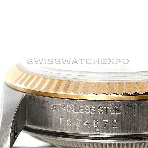 This image shows a close-up side view of a Rolex Datejust 16233 Men's Steel and Gold (two tone) Beige Dial 16233 Men's Steel and Gold (two tone) Beige Dial watch, focusing on the case, bezel, and serial number engraving.