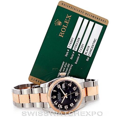 The image shows a Rolex Datejust 116201 Men's Steel and Gold (two tone) Black Dial 116201 Men's Steel and Gold (two tone) Black Dial watch laid out with its metal bracelet and a green certification card behind it.