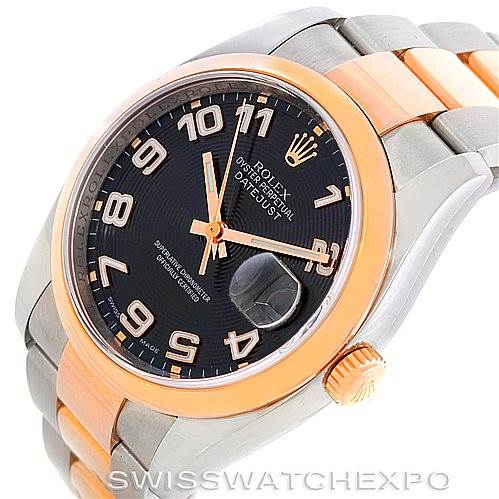 This image shows a Rolex Datejust 116201 Men's Steel and Gold (two tone) Black Dial 116201 Men's Steel and Gold (two tone) Black Dial watch at a slight angle, highlighting the face, bezel, crown, and part of the bracelet.