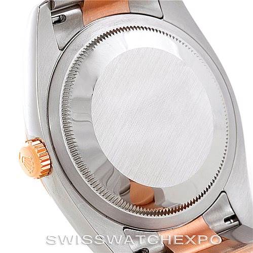 This image shows the case back and winding crown of a Rolex Datejust 116201 Men's Steel and Gold (two tone) Black Dial 116201 Men's Steel and Gold (two tone) Black Dial watch.