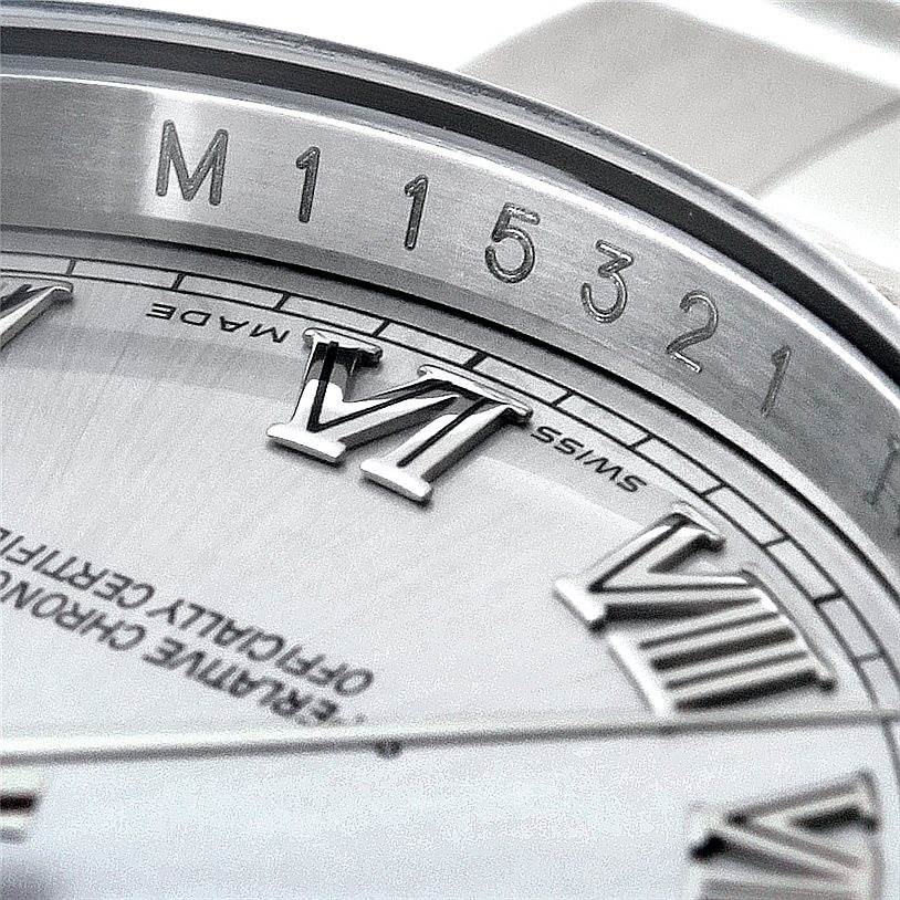 The image shows a close-up angle of the Rolex Datejust 116234 Men's Stainless Steel Silver Dial 116234 Men's Stainless Steel Silver Dial watch, focusing on the serial number, dial, and Roman numeral markers.