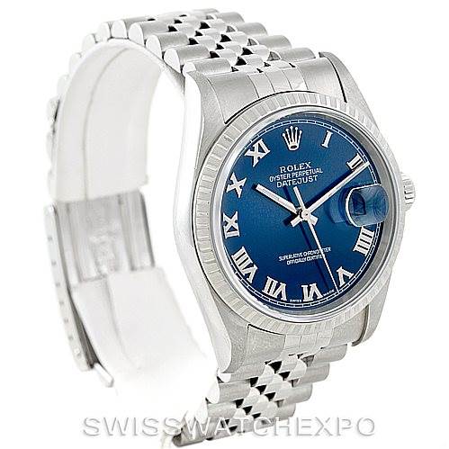 The photo shows a Rolex Datejust 16220 Men's Stainless Steel Blue Dial 16220 Men's Stainless Steel Blue Dial watch at a three-quarter angle, highlighting its blue dial, fluted bezel, and jubilee bracelet.