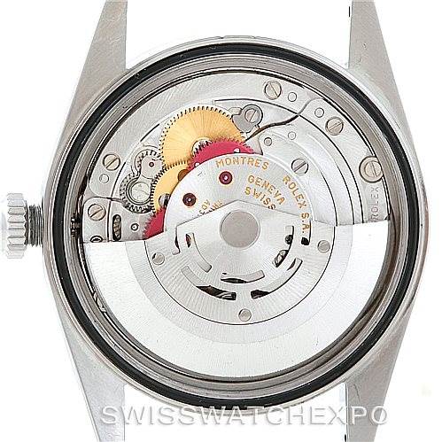 This image shows the back angle of a Rolex Datejust 16220 Men's Stainless Steel Blue Dial 16220 Men's Stainless Steel Blue Dial watch, displaying its internal movement and mechanical parts.