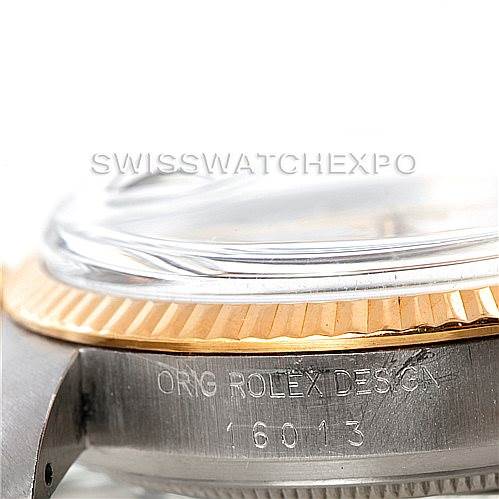 This image shows a close-up side view of a Rolex Datejust 16013 Men's Stainless Steel White Dial 16013 Men's Stainless Steel White Dial watch case, highlighting the bezel and part of the crystal with the model number 16013 engraved.
