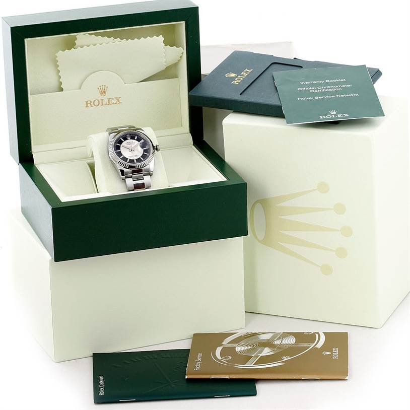 The image shows a Rolex Datejust 116234 Men's Stainless Steel Black Dial 116234 Men's Stainless Steel Black Dial watch in its box, with accompanying booklets and packaging accessories.