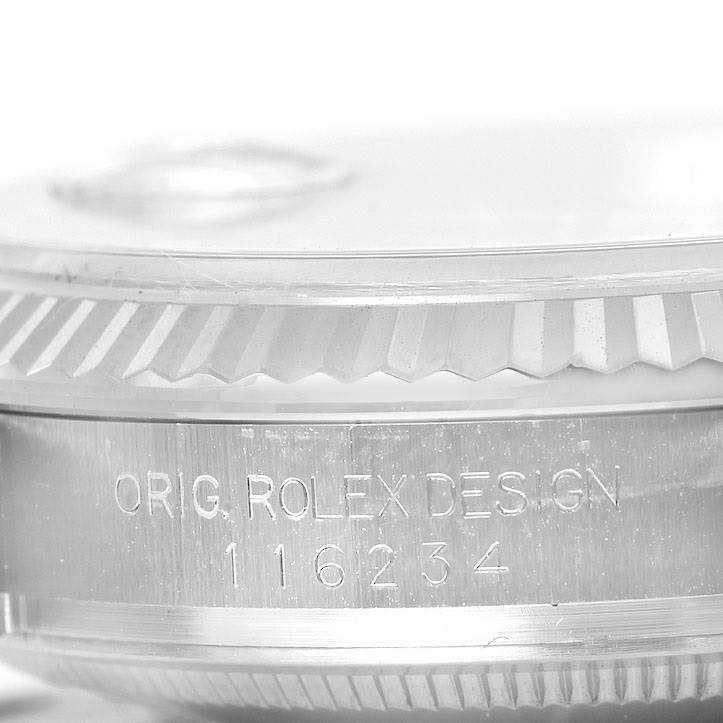This image shows the side of the bezel and case with engravings of the Datejust model by Rolex.
