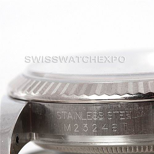 The image shows a close-up of the side of a Rolex Datejust 116234 Men's Stainless Steel Silver Dial 116234 Men's Stainless Steel Silver Dial watch, highlighting the stainless steel case with engraving.
