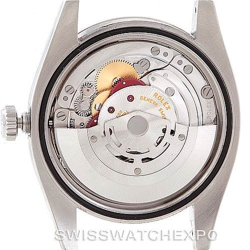 This image shows the rear case open, revealing the movement and rotor of a Rolex Datejust 116234 Men's Stainless Steel Silver Dial 116234 Men's Stainless Steel Silver Dial watch.