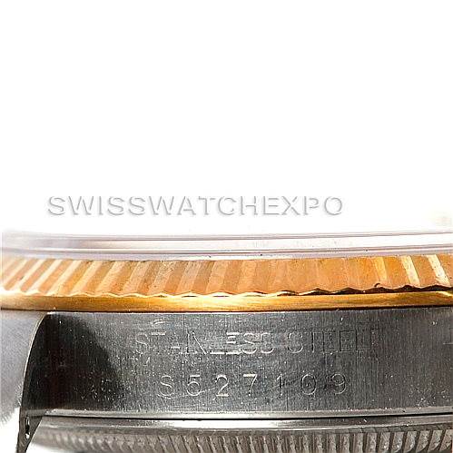 The image shows a close-up of the side of a Rolex Datejust 16233 Men
s Steel and Gold (two tone) Beige Dial 16233 Men
s Steel and Gold (two tone) Beige Dial watch, focusing on the bezel and part of the case with the serial number.