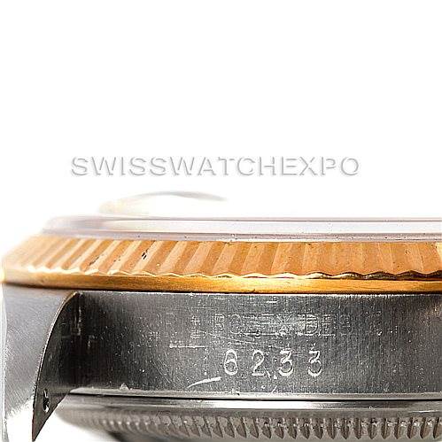 The image shows a close-up angle of the bezel and casing of a Rolex Datejust 16233 Men
s Steel and Gold (two tone) Beige Dial 16233 Men
s Steel and Gold (two tone) Beige Dial watch.