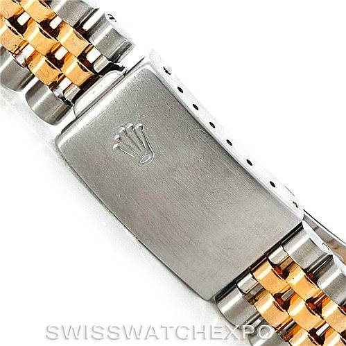 The image displays the clasp and part of the bracelet of a Rolex Datejust 16233 Men
s Steel and Gold (two tone) Beige Dial 16233 Men
s Steel and Gold (two tone) Beige Dial watch, showing the brand
s logo.