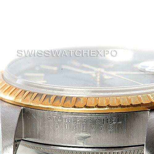 This image shows a side view of a Rolex Datejust 15223 Men's Steel and Gold (two tone) Black Dial 15223 Men's Steel and Gold (two tone) Black Dial watch, highlighting the two-tone stainless steel case and gold bezel.