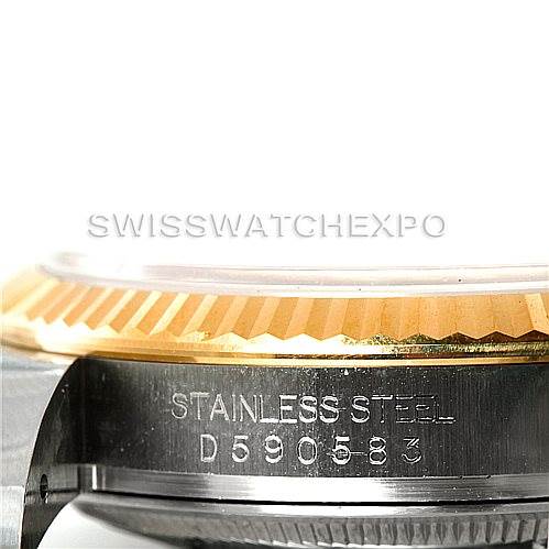 This image shows a close-up of the case side and fluted bezel of a Rolex Datejust 116233 Men's Stainless Steel Blue Dial 116233 Men's Stainless Steel Blue Dial watch, highlighting the "Stainless Steel" engraving.