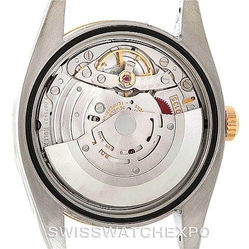 The image shows the back view of a Rolex Datejust 116233 Men's Stainless Steel White Dial 116233 Men's Stainless Steel White Dial watch, exposing the internal movement mechanism.