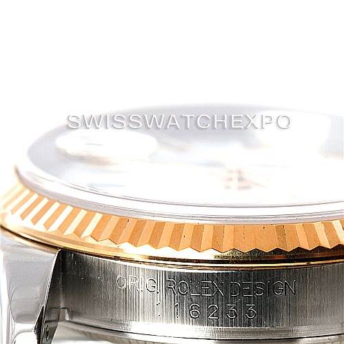 This image shows a close-up side angle of a Rolex Datejust 116233 Men's Stainless Steel White Dial 116233 Men's Stainless Steel White Dial watch focusing on the bezel and part of the case with engraving.