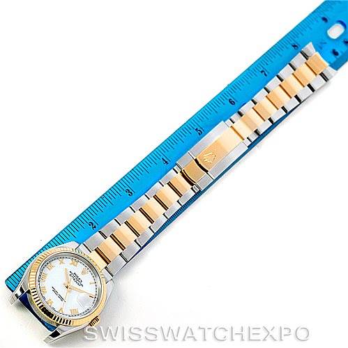 This image shows a Rolex Datejust 116233 Men's Stainless Steel White Dial 116233 Men's Stainless Steel White Dial watch laid flat next to a blue ruler, displaying the watch face and full bracelet.