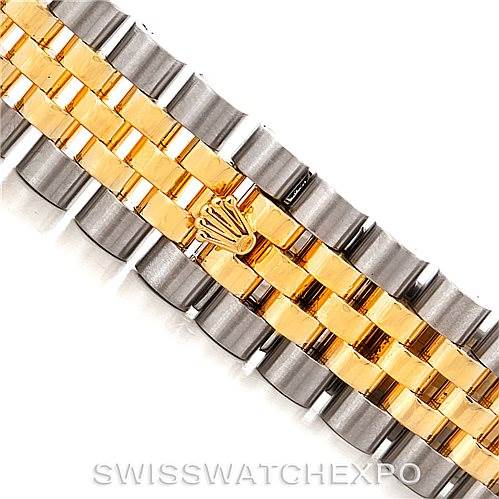 This image shows a close-up of the bracelet of a Rolex Datejust 116233 Men
s Stainless Steel White Dial 116233 Men
s Stainless Steel White Dial watch, featuring steel and gold links.