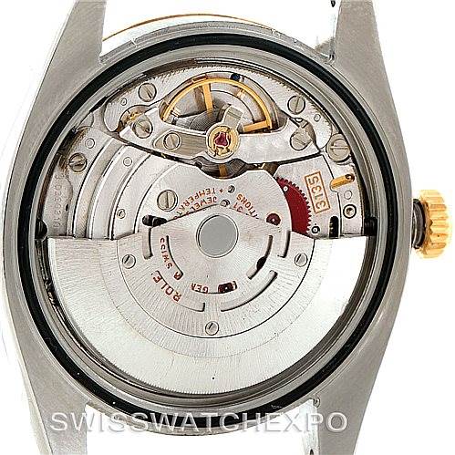 The image shows the internal movement and mechanism of the Rolex Datejust 116233 Men
s Stainless Steel White Dial 116233 Men
s Stainless Steel White Dial watch from a back view with the caseback removed.