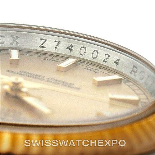 The image shows the edge of the Rolex Datejust 116233 Men
s Stainless Steel Champagne Dial 116233 Men
s Stainless Steel Champagne Dial dial and part of its bezel, including the reference number "Z740024."