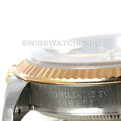 This image shows a close-up side view of a Rolex Datejust 116233 Men
s Stainless Steel Champagne Dial 116233 Men
s Stainless Steel Champagne Dial watch, focusing on the bezel and case with visible serial numbers.