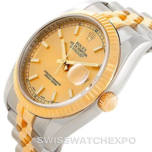 The image shows a Rolex Datejust 116233 Men
s Stainless Steel Champagne Dial 116233 Men
s Stainless Steel Champagne Dial watch at an angle highlighting the gold dial, date window, bezel, and two-tone bracelet.