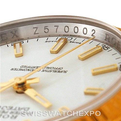 The image shows a close-up of the Rolex Datejust 116233 Men
s Stainless Steel White Dial 116233 Men
s Stainless Steel White Dial model
s dial, hands, and part of the rehaut with the serial number.