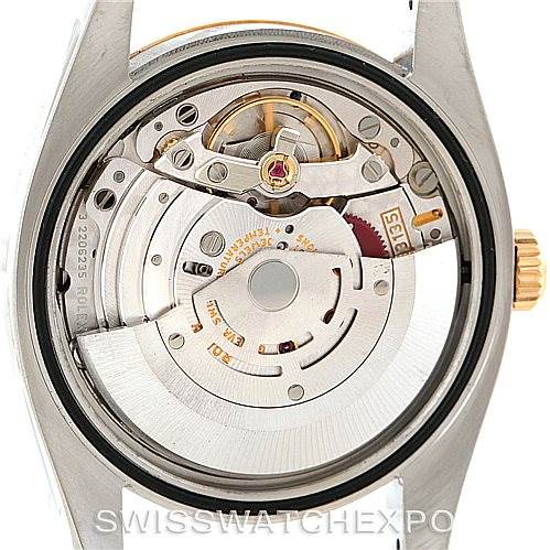 The image shows the inner mechanical movement of a Rolex Datejust 116233 Men
s Stainless Steel White Dial 116233 Men
s Stainless Steel White Dial watch viewed from the back with the case back removed.