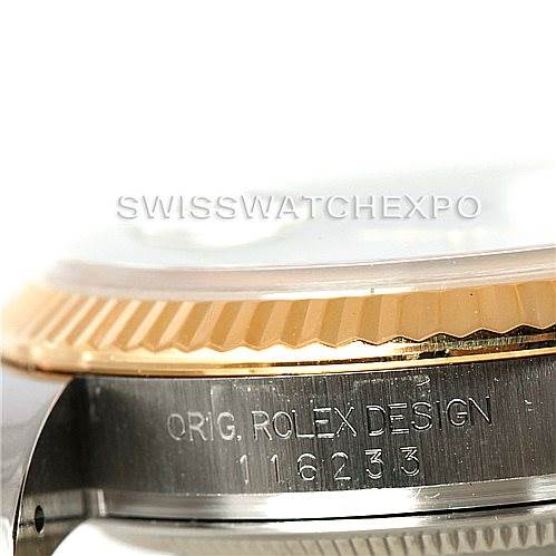 The image shows a close-up of the side of a Rolex Datejust 116233 Men
s Stainless Steel White Dial 116233 Men
s Stainless Steel White Dial watch, focusing on the bezel and engraved serial number.