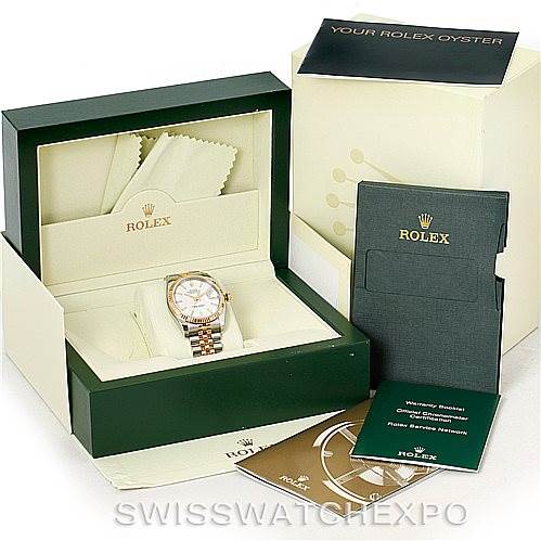 The image shows a Rolex Datejust 116233 Men
s Stainless Steel White Dial 116233 Men
s Stainless Steel White Dial watch with its accessories, including the box, warranty booklet, and manuals, viewed from above.