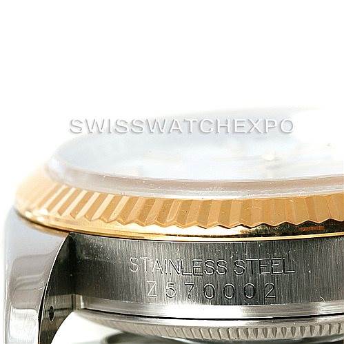 This image shows a close-up of the side of a Rolex Datejust 116233 Men
s Stainless Steel White Dial 116233 Men
s Stainless Steel White Dial, highlighting its stainless steel body and fluted bezel.