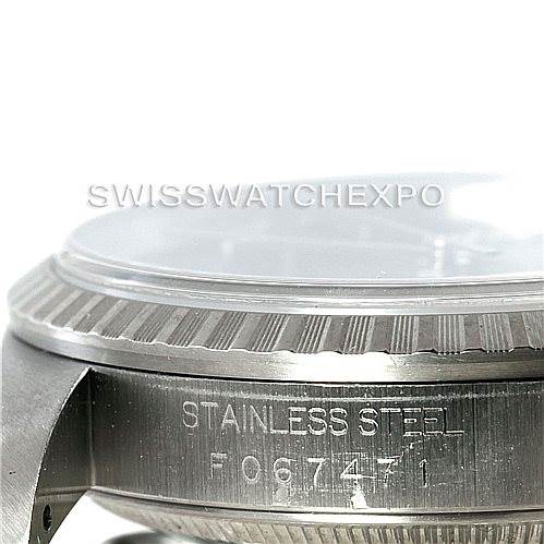 This image shows the side view of the bezel and case of a Rolex Datejust 16220 Men
s Stainless Steel Black Dial 16220 Men
s Stainless Steel Black Dial watch, featuring the stainless steel casing and engravings.