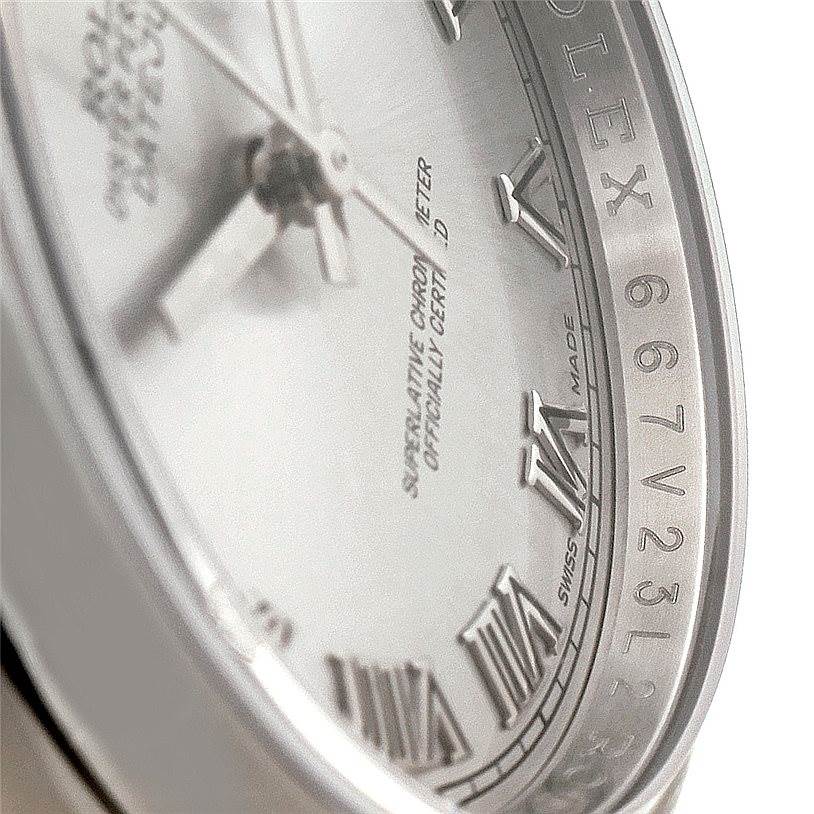 This close-up angle of the Rolex Datejust 116200 Men
s Stainless Steel Grey Dial 116200 Men
s Stainless Steel Grey Dial watch showcases the dial, hands, and part of the case with Roman numeral markers.
