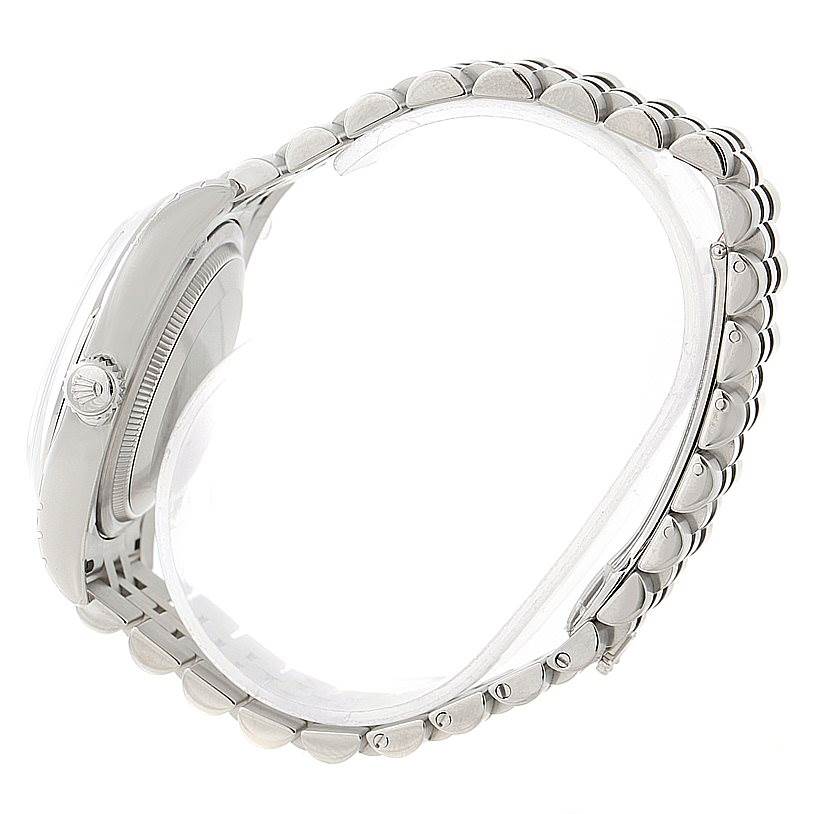 The image shows a side profile of a Rolex Datejust 116200 Men
s Stainless Steel Grey Dial 116200 Men
s Stainless Steel Grey Dial watch, highlighting the case, crown, and portions of the bracelet.