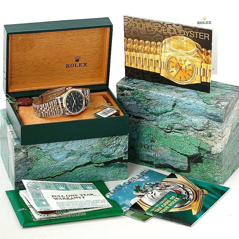 The image shows a Rolex Datejust 16233 Men's Steel and Gold (two tone) Black Dial 16233 Men's Steel and Gold (two tone) Black Dial watch in its box with accompanying manuals and warranty documents.