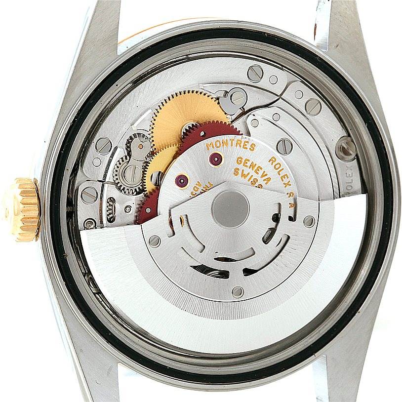 This image shows the internal mechanism of a Rolex Datejust 16233 Men's Steel and Gold (two tone) Black Dial 16233 Men's Steel and Gold (two tone) Black Dial watch, including gears and the oscillating weight.
