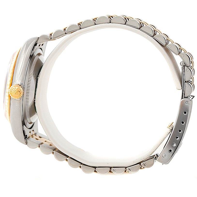 This is a side view of the Rolex Datejust 16233 Men's Steel and Gold (two tone) Black Dial 16233 Men's Steel and Gold (two tone) Black Dial watch, showing the crown, case, and part of the bracelet.