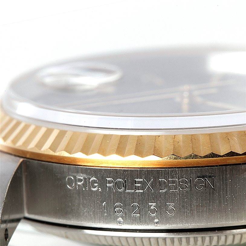 This is a close-up side view of the Rolex Datejust 16233 Men's Steel and Gold (two tone) Black Dial 16233 Men's Steel and Gold (two tone) Black Dial, showing the bezel, crystal, and model number 16233.