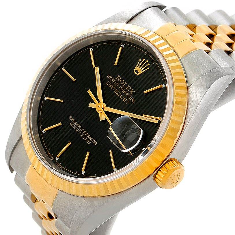 The image shows a Rolex Datejust 16233 Men's Steel and Gold (two tone) Black Dial 16233 Men's Steel and Gold (two tone) Black Dial watch at an angled close-up, highlighting the black dial, date window, and the two-tone bracelet.
