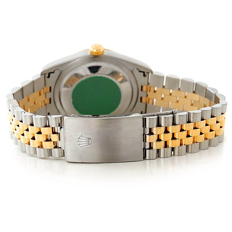 This image shows the clasp and back of the band of a Rolex Datejust 16233 Men's Steel and Gold (two tone) Black Dial 16233 Men's Steel and Gold (two tone) Black Dial watch, highlighting its two-tone metal bracelet.