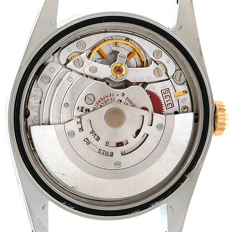 This image shows the movement mechanism of a Rolex Datejust 16233 Men's Steel and Gold (two tone) Beige Dial 16233 Men's Steel and Gold (two tone) Beige Dial watch viewed from the case back.